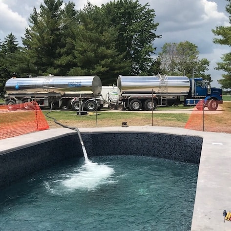 Bright Water Services truck delivering water for a residential pool fill