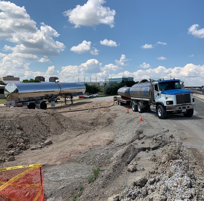 Water tanker trucks on a construction site